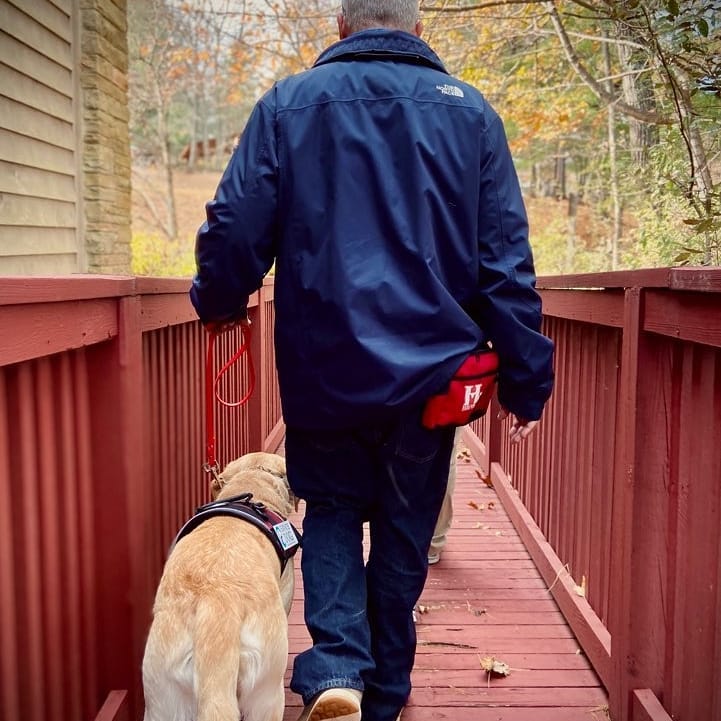 steve chase walking with mickey service dog